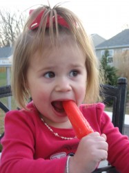 Eating her popcicle!