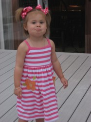 Making her pouty face.