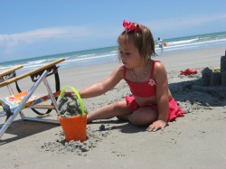 Building her castle in the bucket.